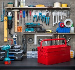 A beautifully organized workbench with tools hanging neatly on the wall