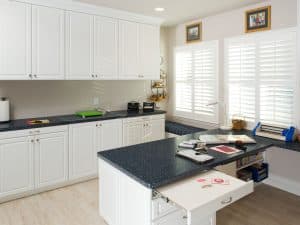 A hobby space in white melamine with dark countertops
