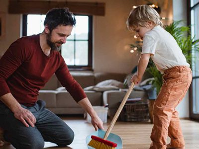Dad cleaning with kid