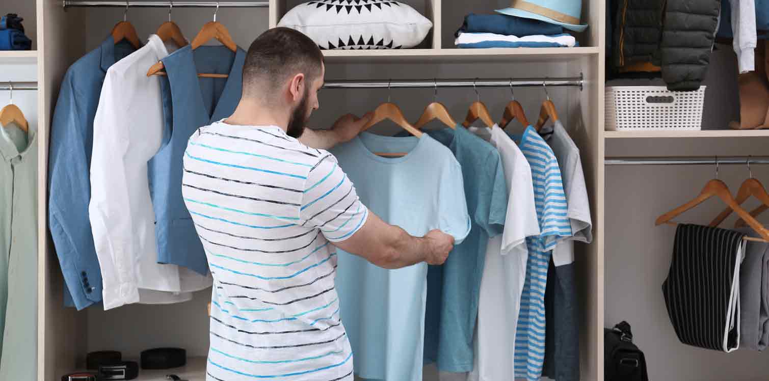 man organizing his closet