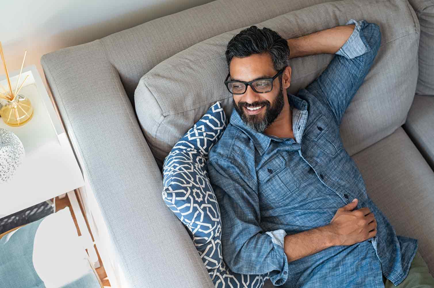 man relaxing on a couch