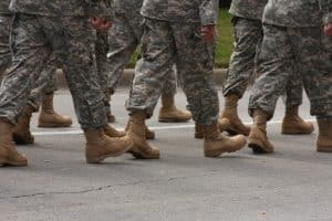 A group of warriors march past the camera