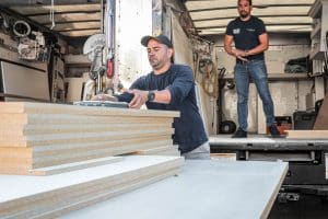 Workmen load a truck