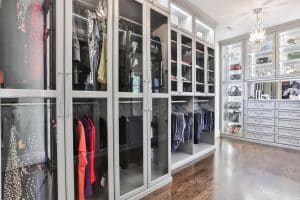 A grey closet with glass doors
