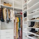 Custom walk-in closet with pull out drawers and open shoe shelving