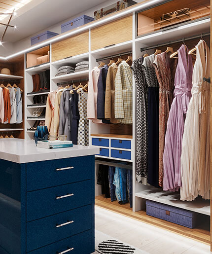 Walk in closet with custom shelves and island