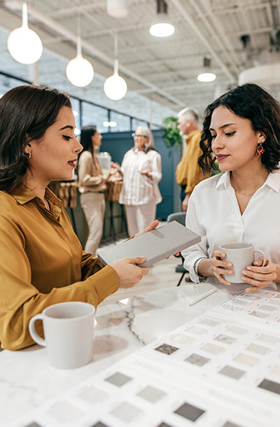 Designer and customer reviewing samples