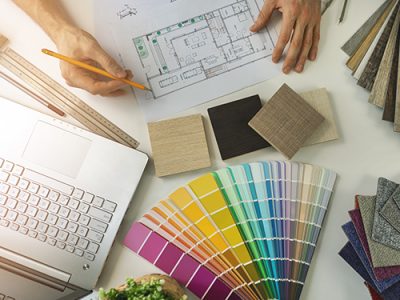 Designer with swatches and plans