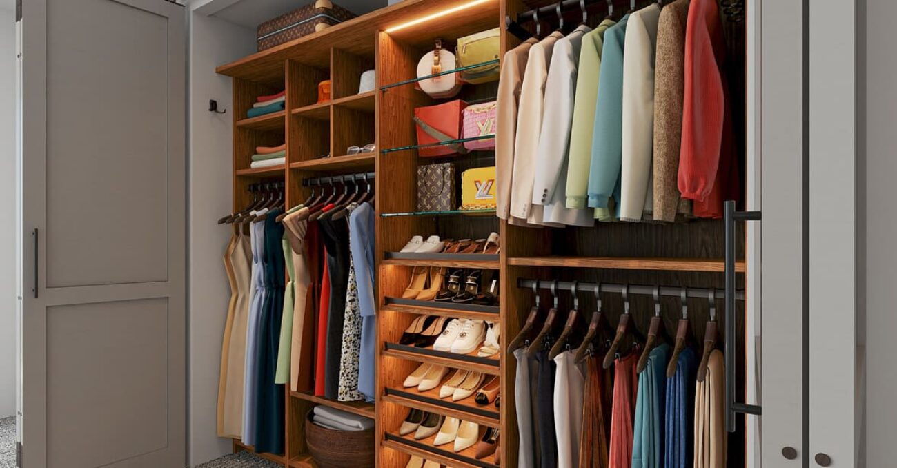 Built-in custom closet Rustic Cherry melamine with glass shelving, angled shoe shelves, and triple-hang wardrobe rods. Integrated lighting and cubby storage maximize space and visibility.