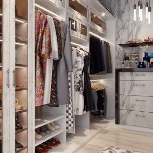 Modern walk-in custom closet with white marble cabinetry