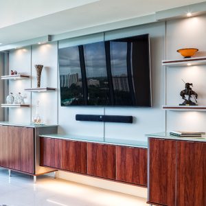 Sleek entertainment center with floating shelves with underlighting