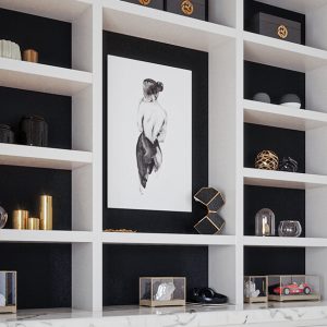 Custom white shelving with contrasting black back panels for displaying decorative items.