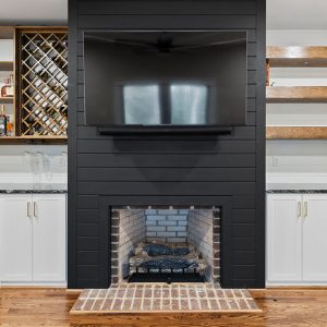 Custom wine bar with wine lattice and custom bar cabinetry