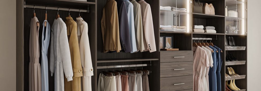 Sleek walk-in closet featuring dark wood cabinetry, glass display doors, LED lighting, and organized hanging sections for suits, dresses, and shoes