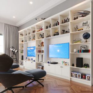Custom playroom shelving with TV mounts and toy display