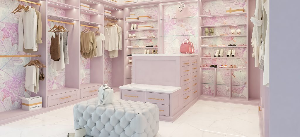 Pink walk-in closet with custom cabinetry, built-in drawers, and open shelving