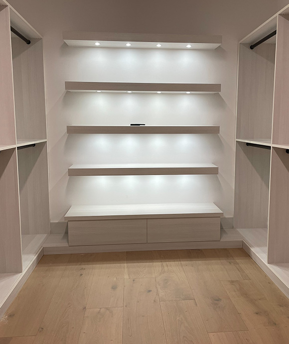 Walk in closet with Full depth soft close drawers and Purse and Shoe display area