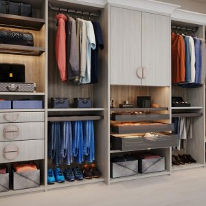 Custom reach-in closet with pant hangers, custom cabinets and drawers