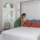 Wall bed opened to transform room to guest room