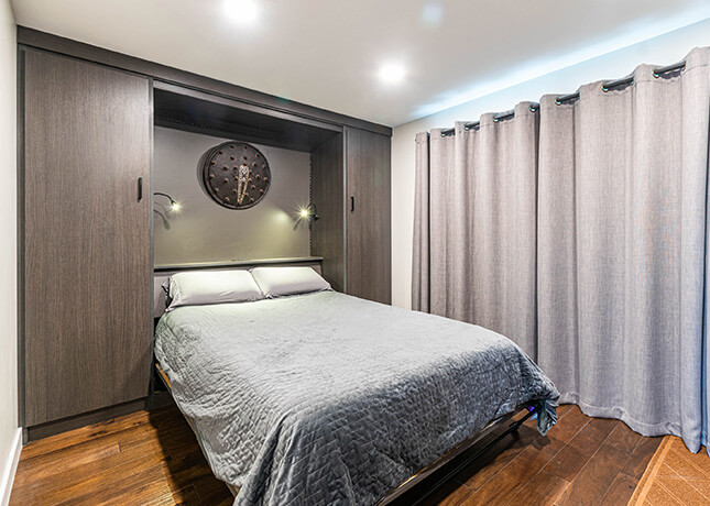 Condo bedroom with wall bed