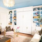Custom wall bed concealed in white shaker cabinetry