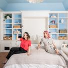 Go2Girls designers sitting on custom murphy bed