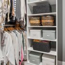 Custom closet shelving with concealed storage