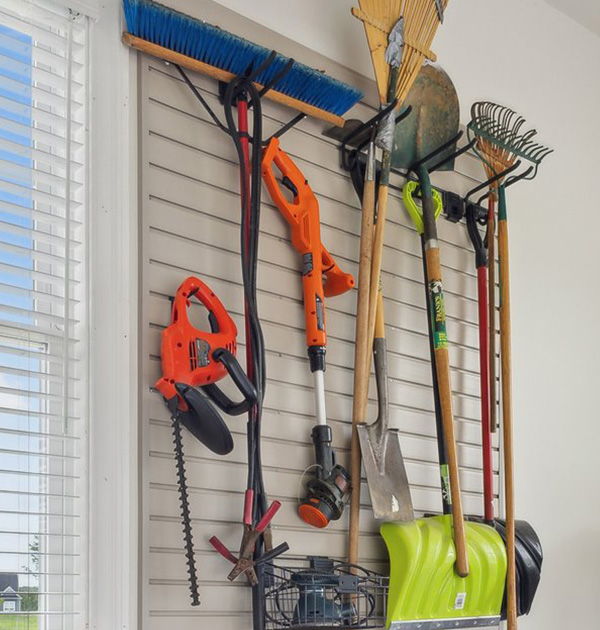 Slatwall organizers and utility hooks in garage