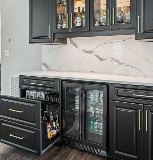 Pull out beverage drawers and mini fridge in custom pantry