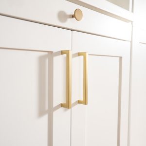 Gold hardware on wall bed cabinets