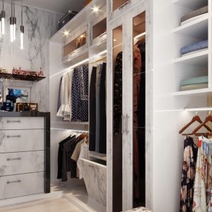 Custom walk-in closet with marble accents and backlit shelving
