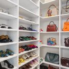 Accessory organization in closet with white gloss shelving for shoes and purses