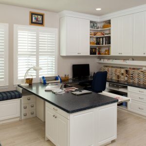 Craft room with window seat, custom island with crafting zone