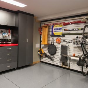 Custom garage slatwall organizer for bikes, surf boards, and tools