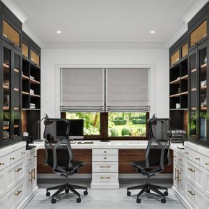 Dual workstation home office with glass-front upper cabinetry, full-extension drawers, overhead cubbies for fabric file boxes, integrated task lighting, and ample desktop space