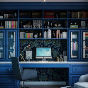 Custom home office with blue built-ins, glass-front cabinets, adjustable shelving, custom drawer inserts, and full wall backing in patterned wallpaper