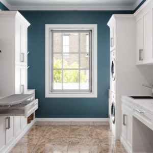 Custom laundry room with pull-out ironing board and laundry sink