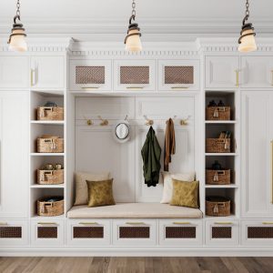 Custom mudroom system with custom cabinetry, crown molding, built-in bench, coat hooks, and cubbies with woven baskets