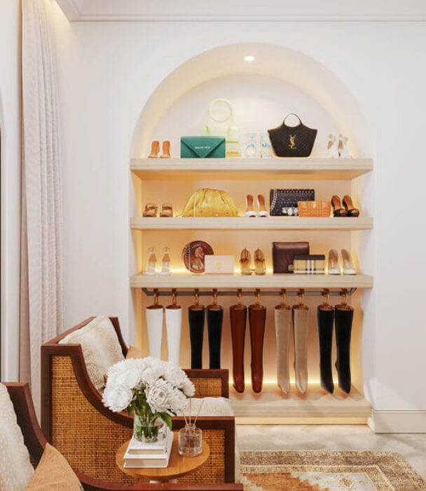 Arched shoe display with hanging boot storage and open shelving