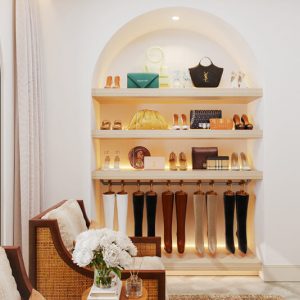 Arched shoe display with hanging boot storage and open shelving