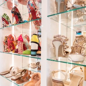 Custom shoe display on glass shelving