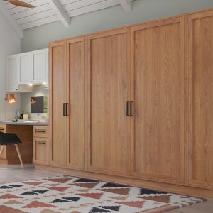 Wall bed with integrated storage and workstation