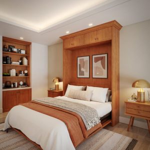Raised-panel wood wall bed in open position with built-in overhead cabinetry