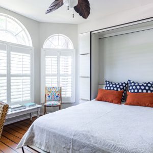 Murphy bed with a hidden frame wall feature