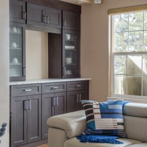 Dark wood built-in cabinetry with upper and lower storage