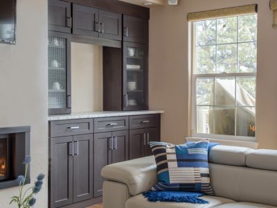 Dark wood built-in cabinetry with upper and lower storage