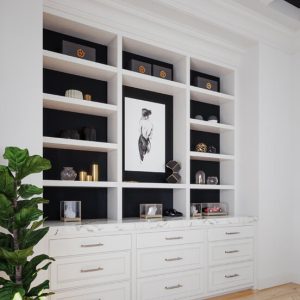 Contemporary built-in with white shelving and black backing and marble countertop