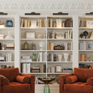 Elegant white built-in wall unit with crown molding, library lighting