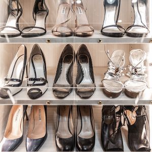 Slanted shoe shelves with Lucite toe catch