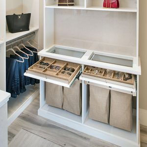 Suede trays for sunglasses and jewelry. Fabric hamper bags below.